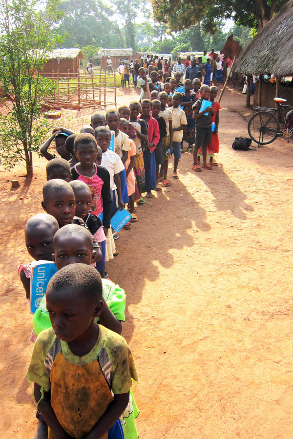 Children waiting to be vaccinated in Kpekpere, DR Congo